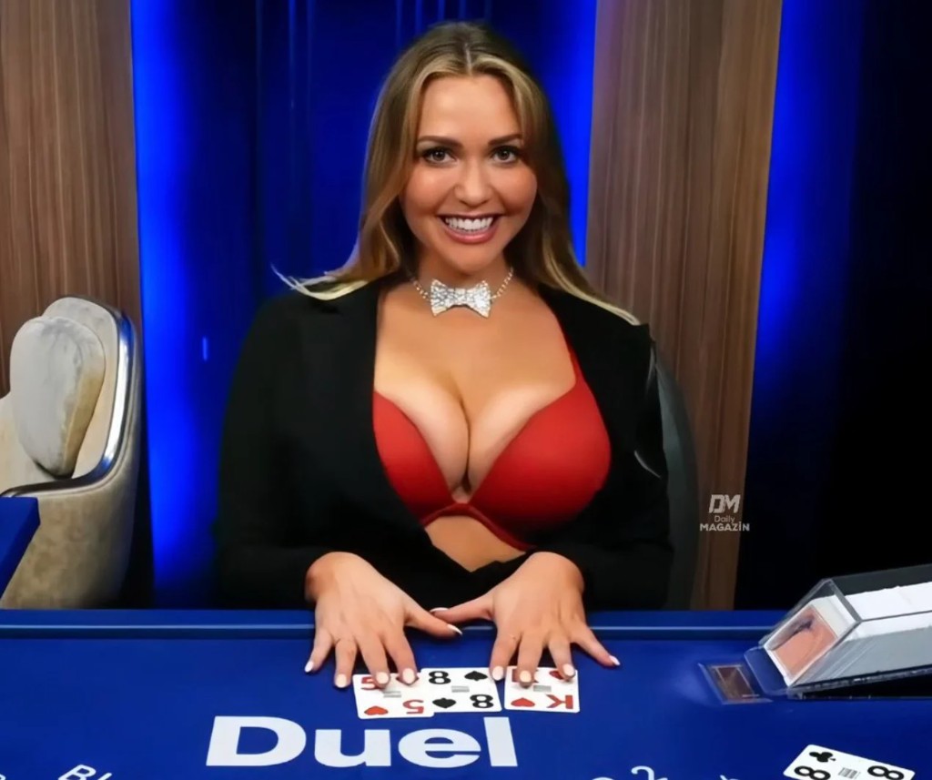 Mia Malkova at the Duel blackjack table under blue studio light